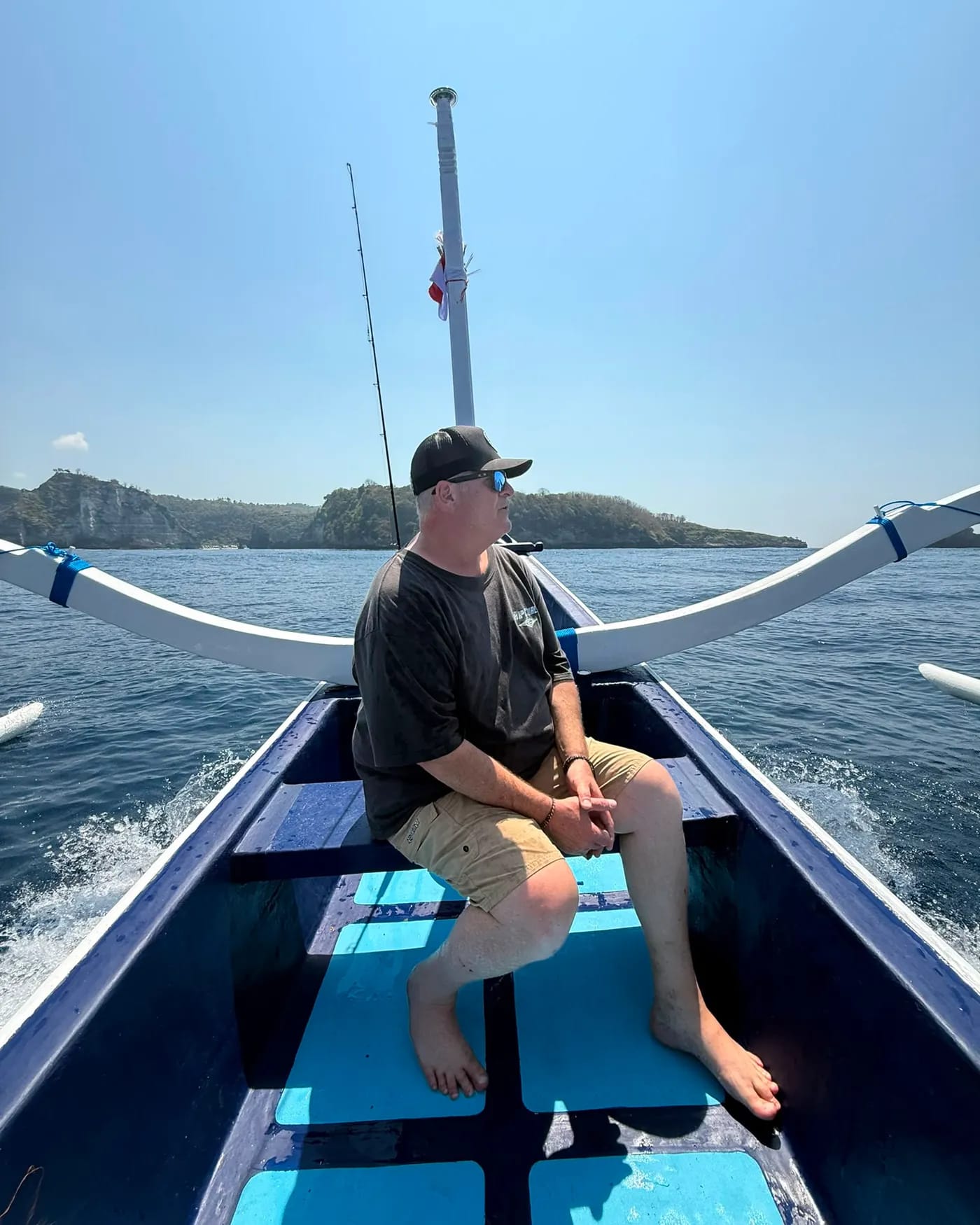 A guest on board with a big tuna caught on the trip